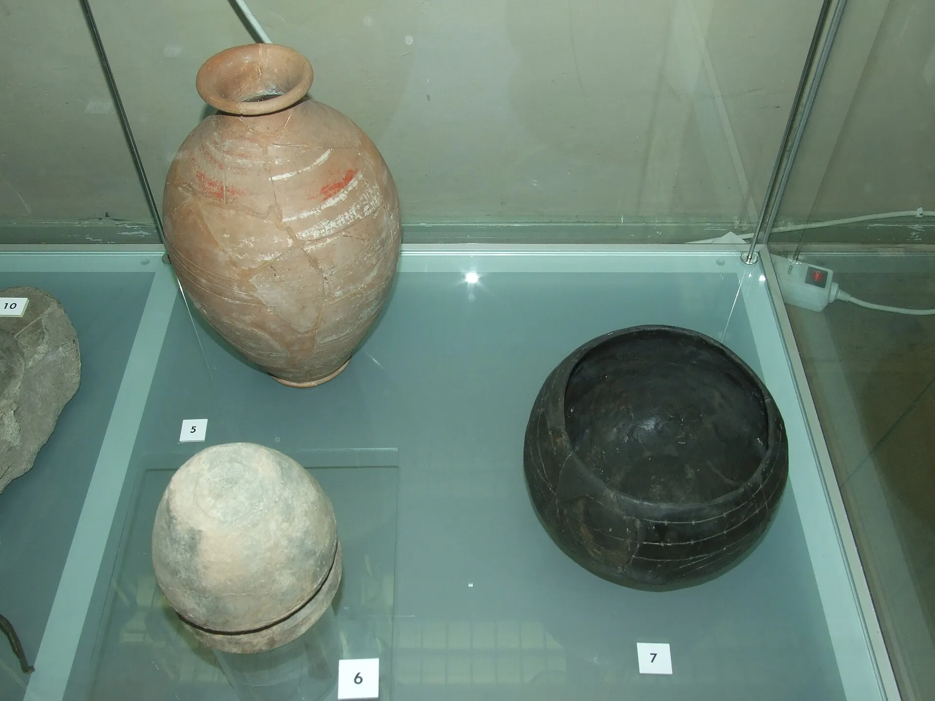 Prehistoric Times of Bohemia, Moravia and Slovakia, National Museum in Prague.
Pottery
5. Wheeled and painted bottle (late La Tène period 150 - 50 BC)
6. Wheeled pot with potters mark (Early Middle Age; 10th - 11th century AD)
7. Pot (Neolithic; linear culture; 5500 - 4800 BC)