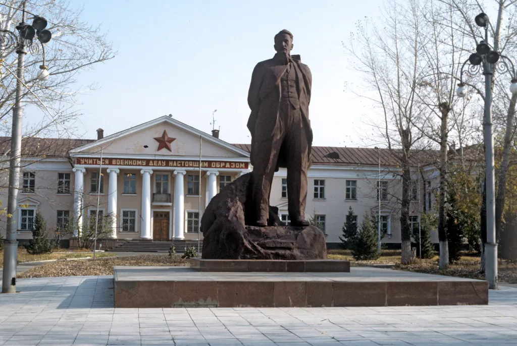 “A monument to Kurchatov on the background of the Semipalatinsk nuclear test site's Central Staff”. A monument to Academician Igor Kurchatov, one of the developers of nuclear weapons and founder of the Semipalatinsk nuclear test site on the background of the site's Central Staff.