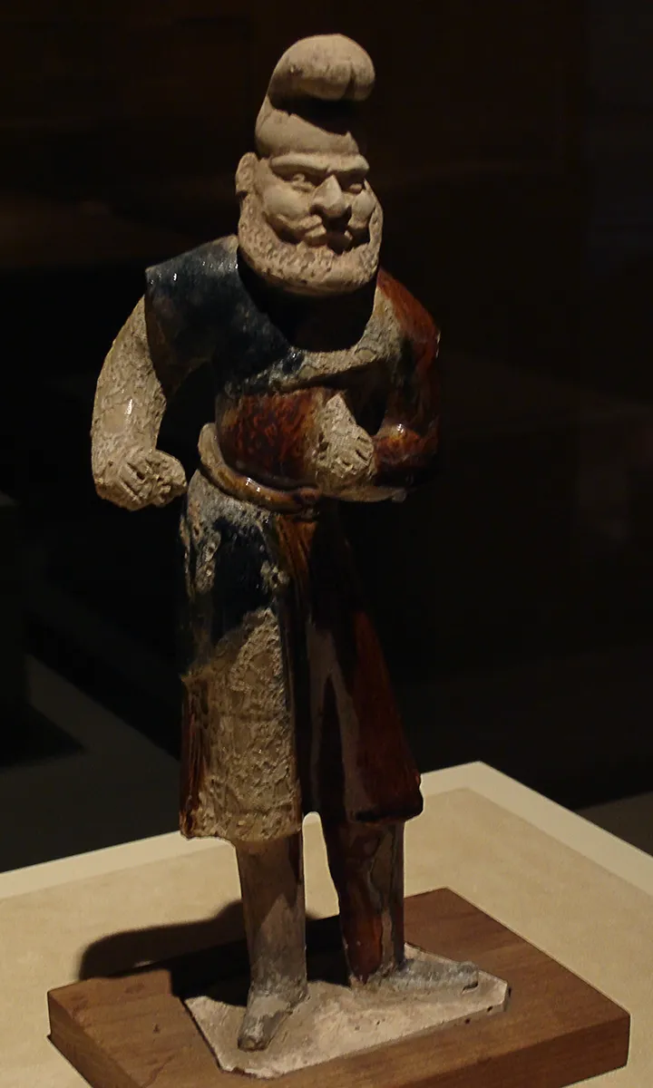 Tri-coloured figurine of a foreigner
Tang Dynasty (A.D. 618 - 907)
Excavated at Xi'an, Shaanxi Province, 1955
This figure represents a foreign stableman from the Western Region of China. The presence of foreigners indicates economic and cultural exchanges between China and Western Asia during the Tang era.