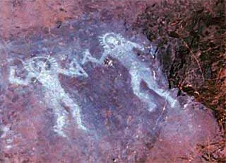 Petroglyphs called "astronauts" recently white coloured (probably plaster). Zurla Area, R 1, Rock Art Natural Reserve of Ceto, Cimbergo and Paspardo. Nadro, Rock Drawings in Valle Camonica.