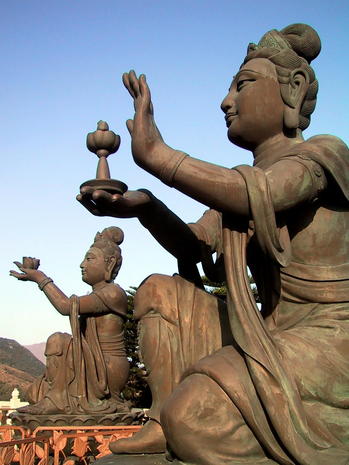 Buddhistic Statues praising the big Buddha (Tian Tan Buddha) on Lantau (Hong Kong).
