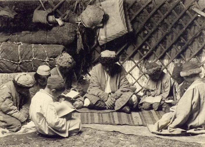 Teacher with students. 19th century