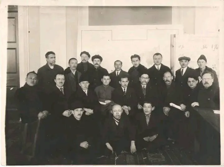 Kasym Tynystanov is standing second from the left in the third row.
